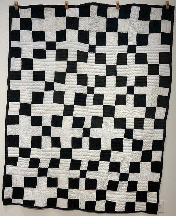 Untitled (black & white checkered quilt)